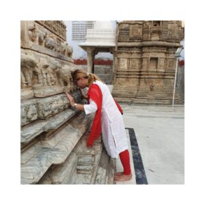 Anita Grabowski at a temple in Udaipur Rajasthan India standing near historic architecture